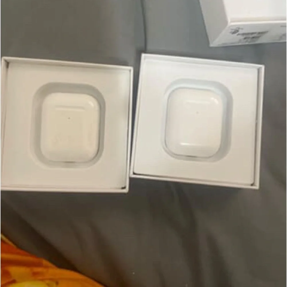 Apple Dual Wireless Earbuds with Charging Cases - White